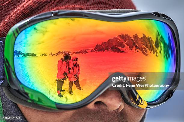 refection of snow lake & karakoram mountains in ski google, biafo hispar snow lake trek, central karakoram national park, gilgit-baltistan, pakistan - google ventures stock pictures, royalty-free photos & images