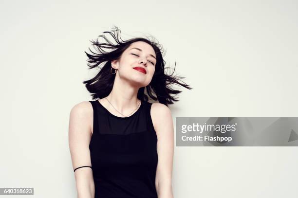 portrait of a carefree young woman - black hair imagens e fotografias de stock