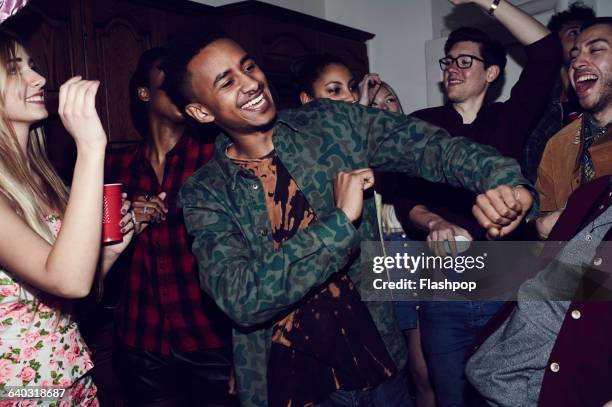 group of friends having fun at a party - friends house stockfoto's en -beelden