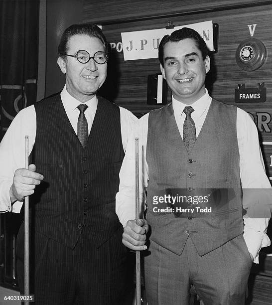 English professional snooker player John Pulman and his Welsh opponent Ray Reardon before the start of the day's session of the World Snooker...