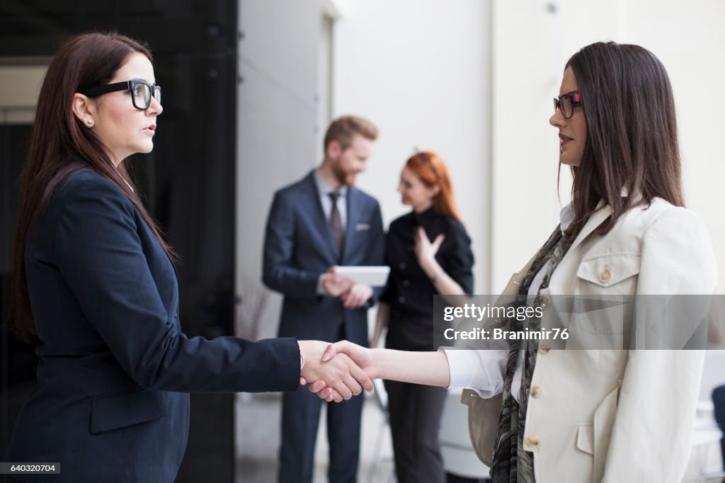 Business team joining hands-hand shake