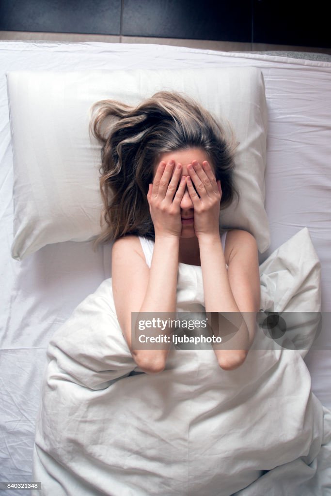 Photo of Woman having insomnia in bed