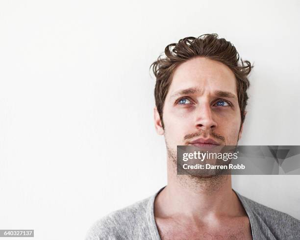 portrait of a pensive man - stubble stockfoto's en -beelden