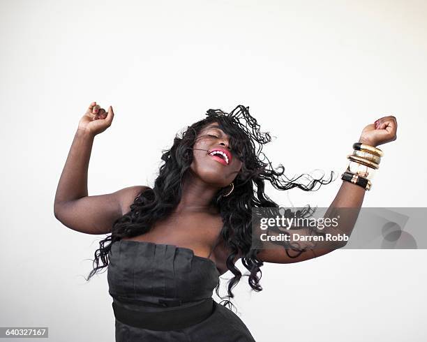 woman dancing and smiling - bangle stock pictures, royalty-free photos & images