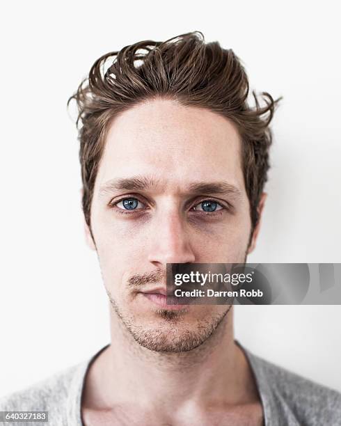 portrait of a man staring - close up faces white background stock pictures, royalty-free photos & images