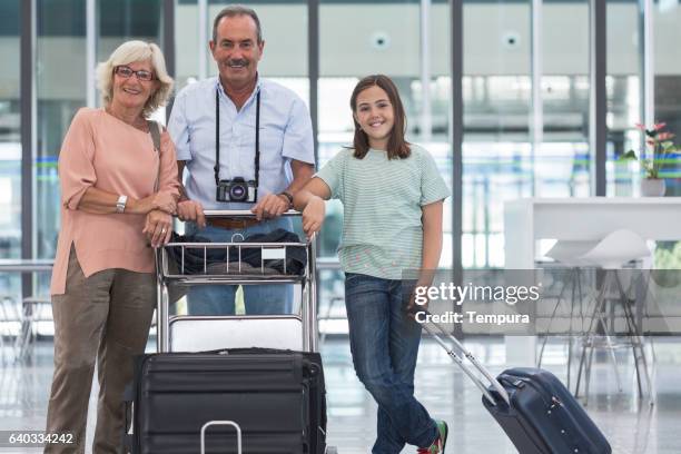grandparents with grandchildren happy before holidays - happy holidays around the world stock pictures, royalty-free photos & images