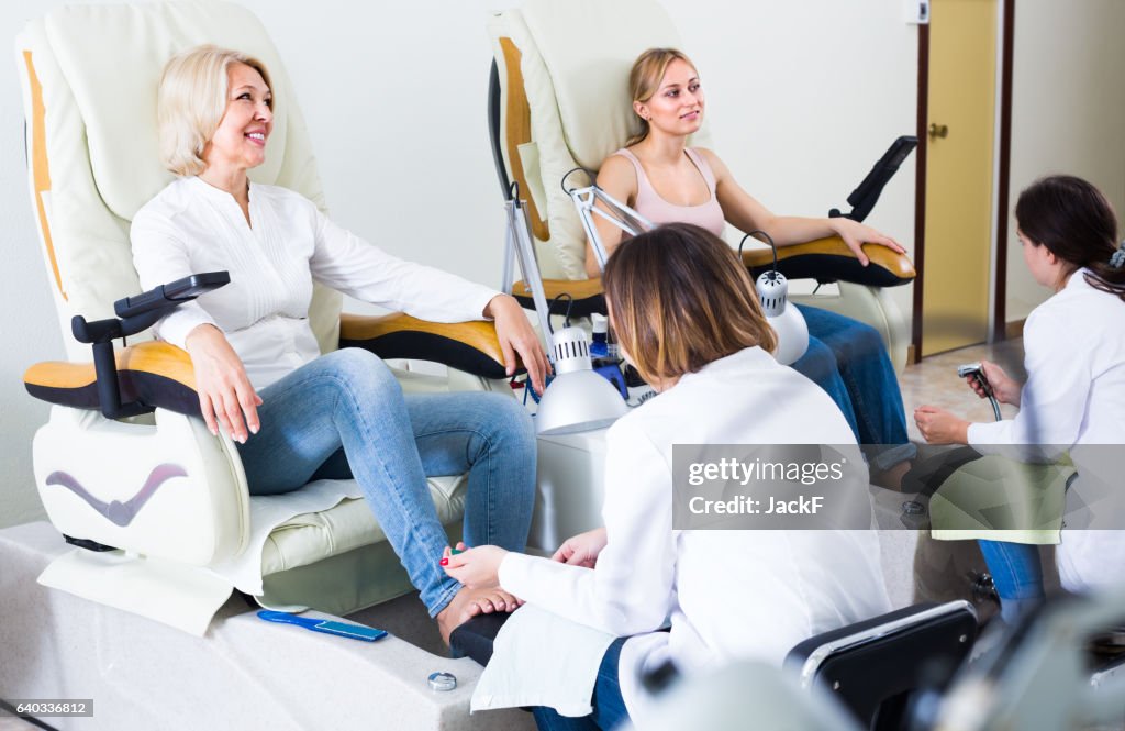 Female clients doing toenails