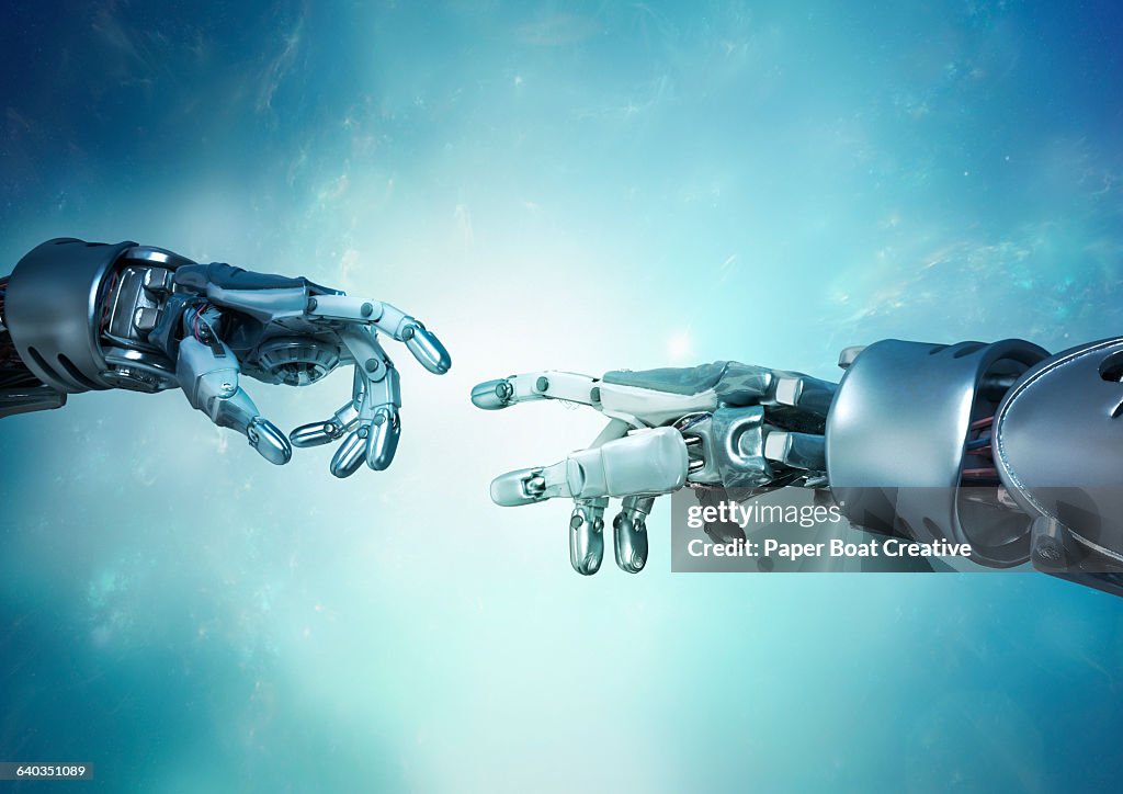 Two robot hands reaching out for each other