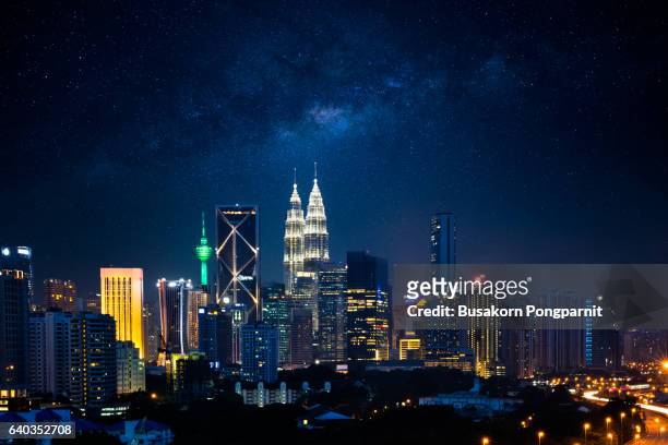 kuala lumpur nightscape with milky way, malaysia - kuala lumpur stock pictures, royalty-free photos & images