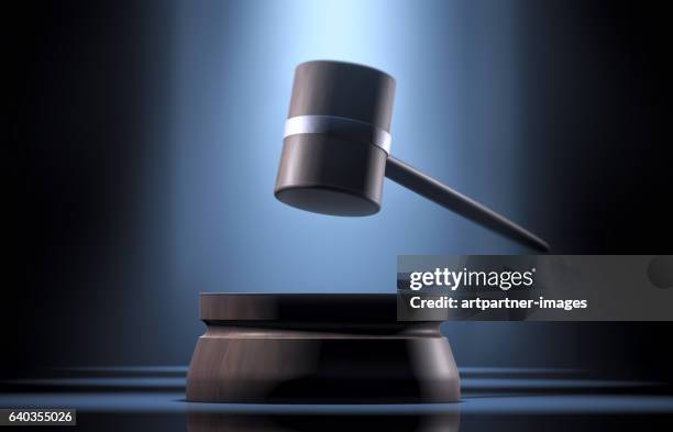 gavel in a spotlight - auction ストックフォトと画像