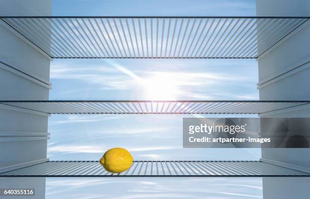 lemon in an empty fridge - raytracing stockfoto's en -beelden