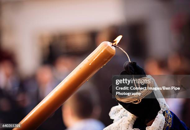 penitents of los negritos brotherhood taking part in processions during semana santa (holy week), seville, andalucia, spain - holy week ceremonies stock pictures, royalty-free photos & images