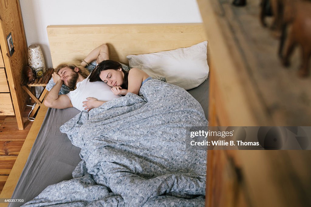 Overhead view of couple waking up