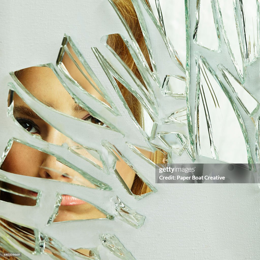 Close up of a young lady looking through glass