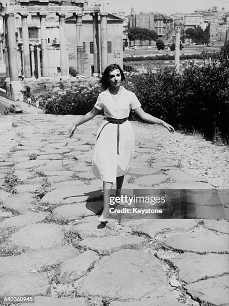 French singer and acress Marie Laforêt sightseeing in the ancient forum in Rome, Italy, circa 1961.