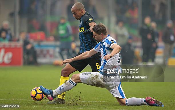 Joao Mario of FC Internazionale Milano battles for the ball with Andrea Coda of Pescara Calcio during the Serie A match between FC Internazionale and...