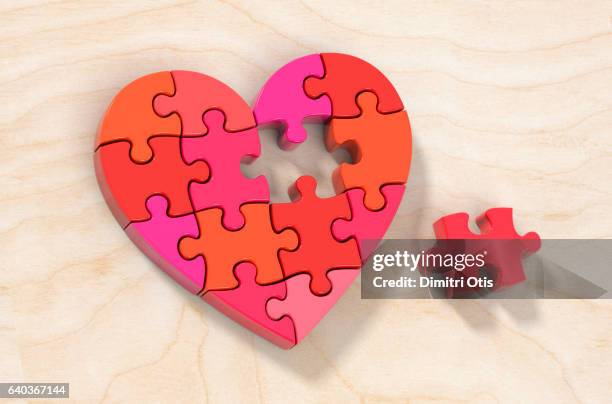 red heart shape jigsaw puzzle, one piece aside - raytracing - fotografias e filmes do acervo