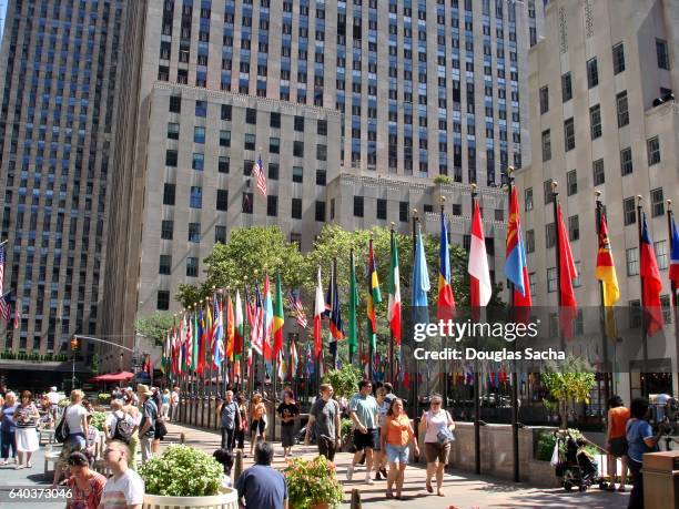 international flags along the rockefeller plaza in manhattan, new york, ny, usa - cosmopolitan nyfw fotografías e imágenes de stock