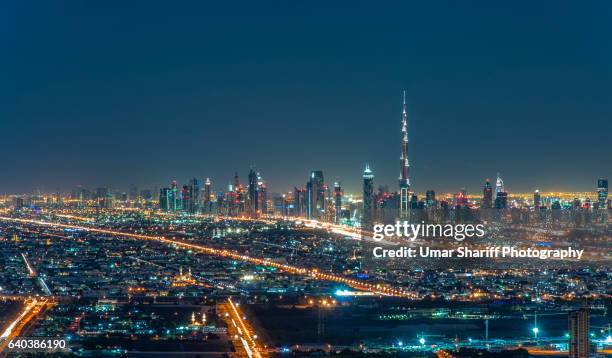 dubai skyline - dubai night stock pictures, royalty-free photos & images