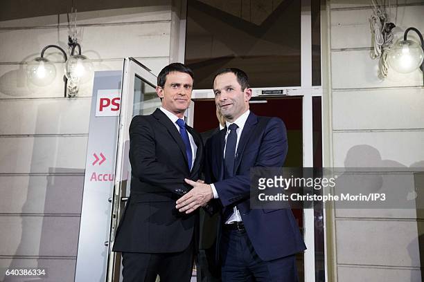 Candidates for the 2017 French Presidential Election, Benoit Hamon and Former Prime Minister Manuel Valls , greet each other after the results of the...