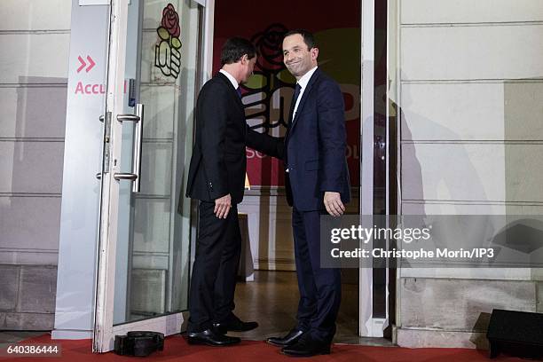 Candidates for the 2017 French Presidential Election, Benoit Hamon and Former Prime Minister Manuel Valls , greet each other after the results of the...