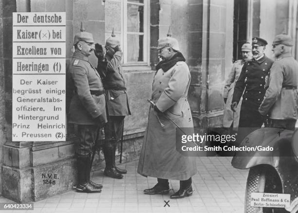 The german Kaiser William II greeting military officers, Prince Henry of Prussia in the background, 1915. From the New York Public Library. .