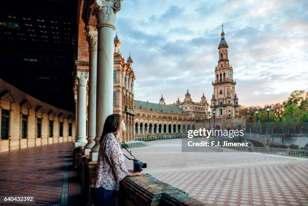 woman in the plaza de espana, seville. - sevilla spain photos et images de collection