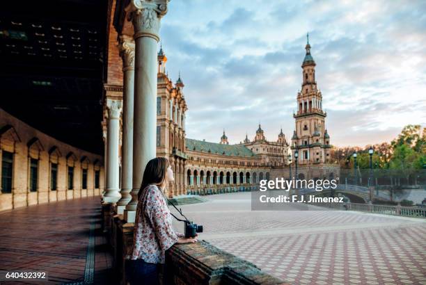woman in the plaza de espana, seville. - seville stock pictures, royalty-free photos & images