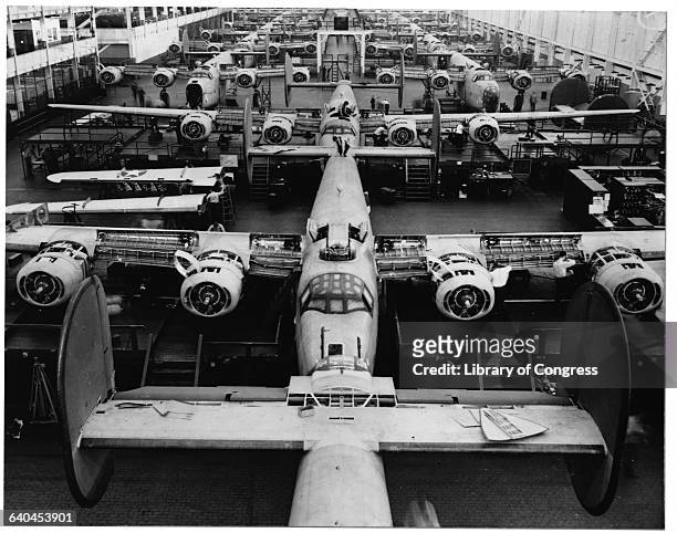 Bombers under construction at a plant in Michigan during World War II. | Location: Willow Run, Michigan, USA.
