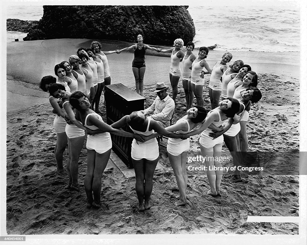 Dimitri Tiomkin at Piano with Dancers on Beach