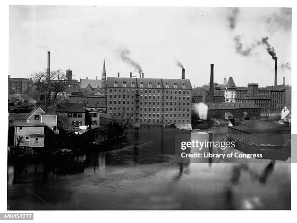 Mills and smokestacks line the Merrimack River in Lowell, Massachusetts.