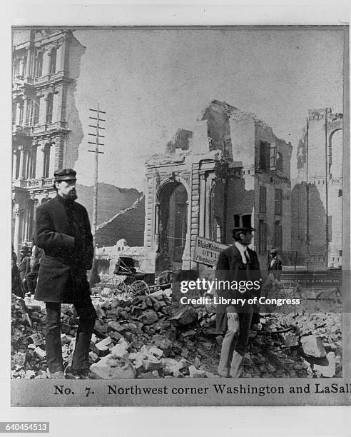 Men stand and look at the ruins of buildings, after the Great Chicago Fire of 1871. | Location: LaSalle Street and Washington Street, Chicago,...