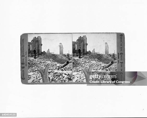 Man stands and looks at the ruins of buildings, after the Great Chicago Fire of 1871. | Location: Randolph Street, Chicago, Illinois, USA.