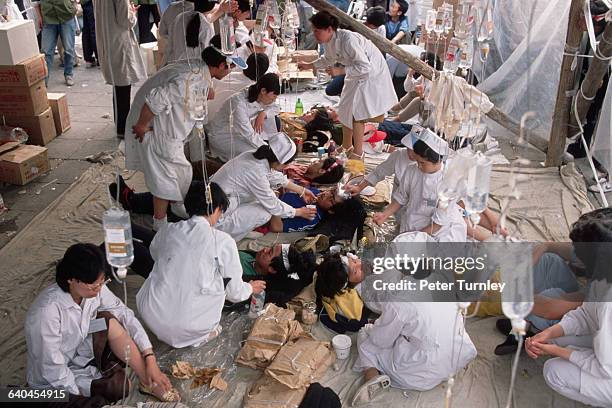 Students from a Beijing nursing school look after hunger strikers during the pro-democracy protests in Tiananmen Square.