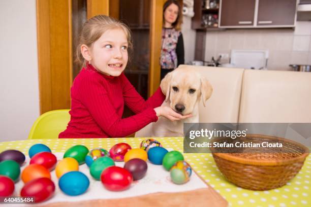 girl surprised by her mother at easter table - caught in the act fotografías e imágenes de stock