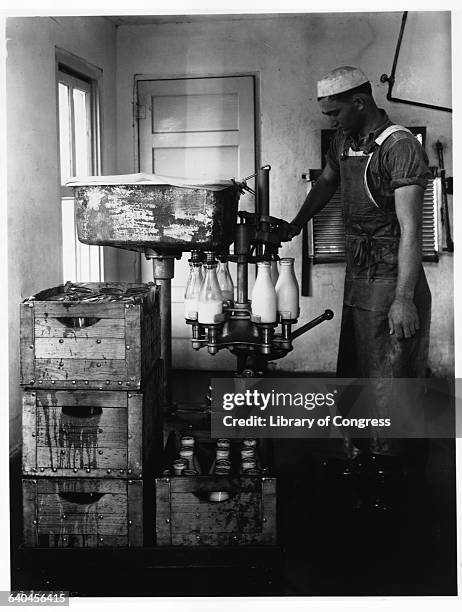Man Bottling Milk