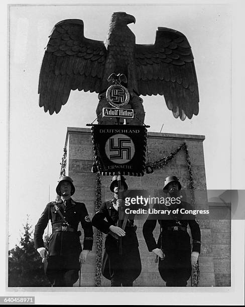 Soldiers carry a standard in the shape of an eagle, at a Nazi Party rally in Germany.