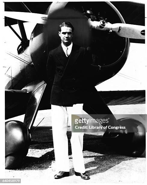 Howard Hughes standing in front of his new Boeing Army Pursuit Plane in Inglewood, California.