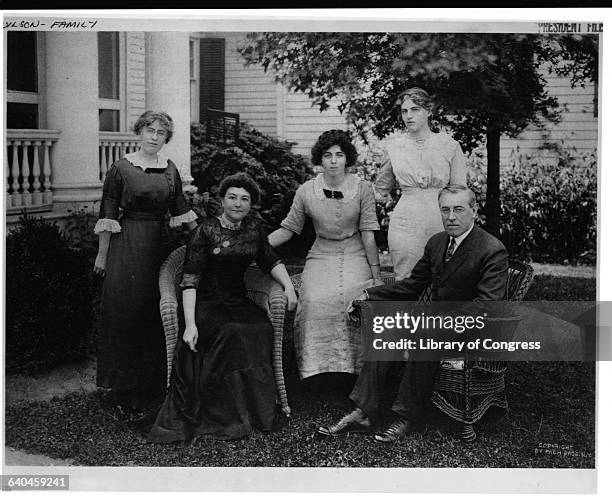 Woodrow Wison sits with his wife Ellen Louise Axson and his three daughters, Margaret, Jessie, and Eleanor .