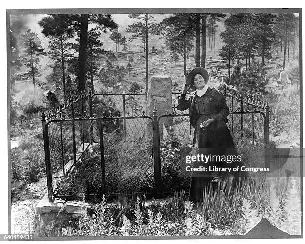 Cowgirl Calamity Jane at Wild Bill Hickock's grave, a man she claimed was a lover at one point. She would be buried next to him in 1903.