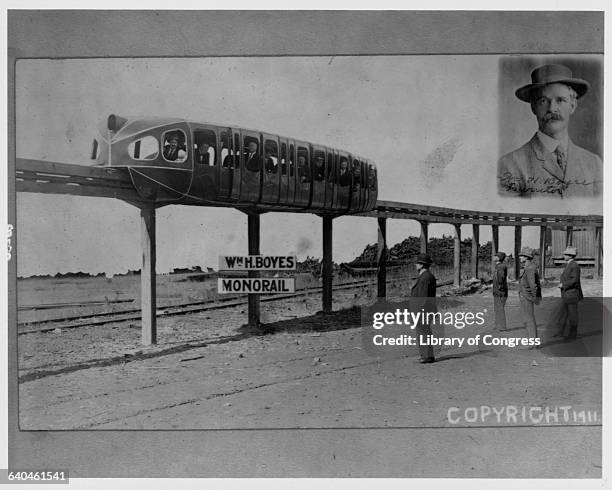 Portrait of William Boyes, inventor of the monorail, next to a working model. Ca. 1911.