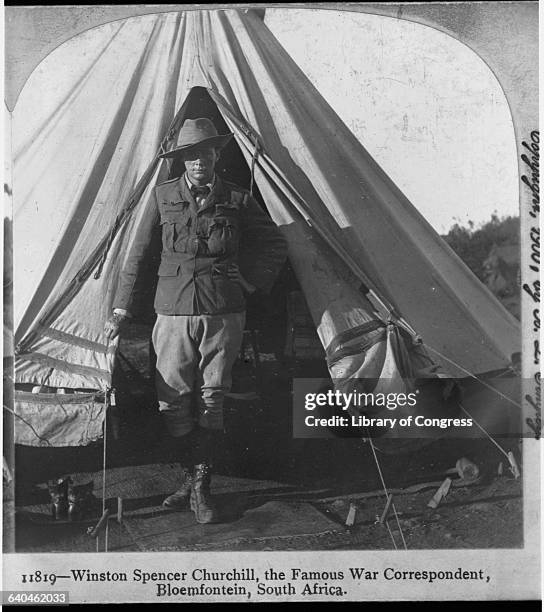 Covering the Boer War in South Africa as a war correspondent, Winston Churchill stands in the doorway of a tent. He would later become British prime...