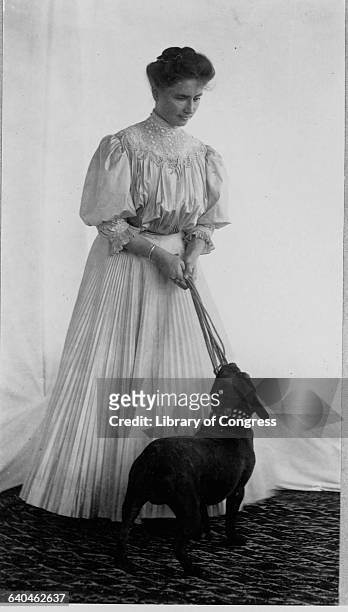 Helen Keller and Dog Playing Tug of War