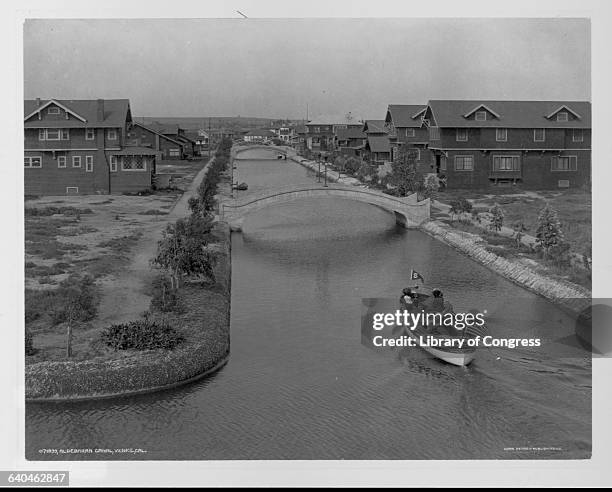 Boat on Aldebaran Canal Passing Houses in Venice, California