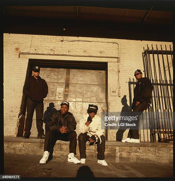Portrait of members of the rap group, NWA, including DJ Yella, MC Ren, Eazy-E , and Dr. Dre .
