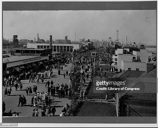Visitors stroll between exhibition halls on the promenades of the 1933 World's Fair in Chicago. Illinois, USA.