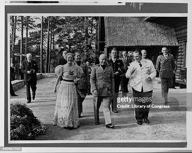 Benito Mussolini walks with Emmy and Hermann Goering at Carinhall, Goering's estate north of Berlin. | Location: Carinhall, Schorfheide, Germany.