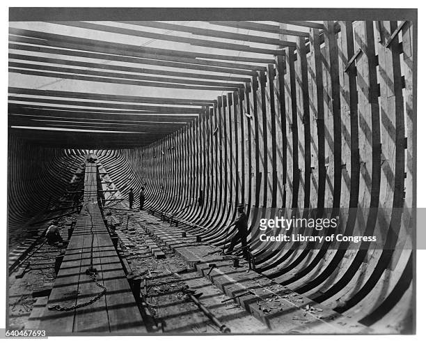 Workers lay the hull of the steamship John G. Christopher, later re-named the Winyah, in Wilmington, Delaware. 1892. | Location: Wilmington, Delware,...