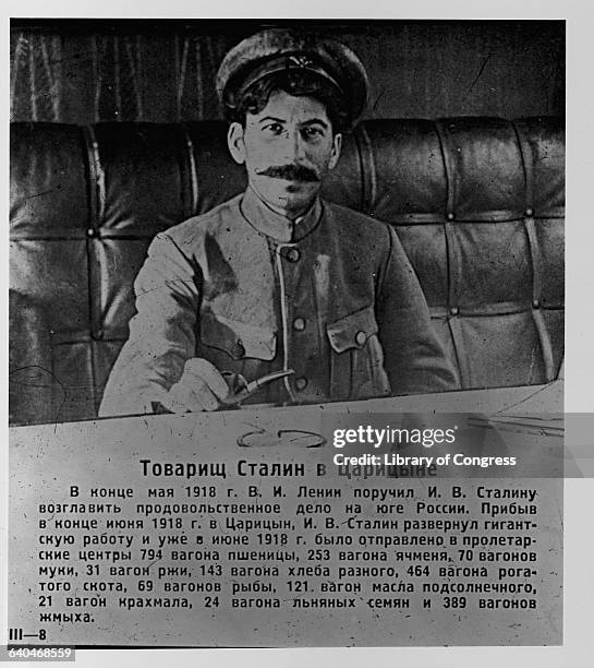 Joseph Stalin Holding Pipe at Table in Tsaritsin