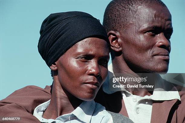 Miner stands with his wife near their home in South Africa's Transkei region while he is on leave from his job in the gold mines near Johannesburg....